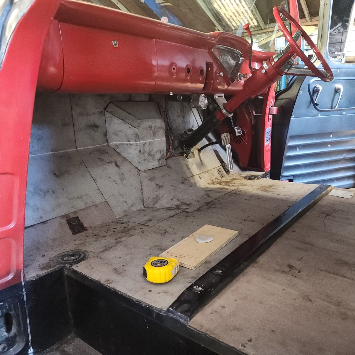 Vintage Ford truck cab interior — bare metal floor before Jay's Auto Trim re-trim