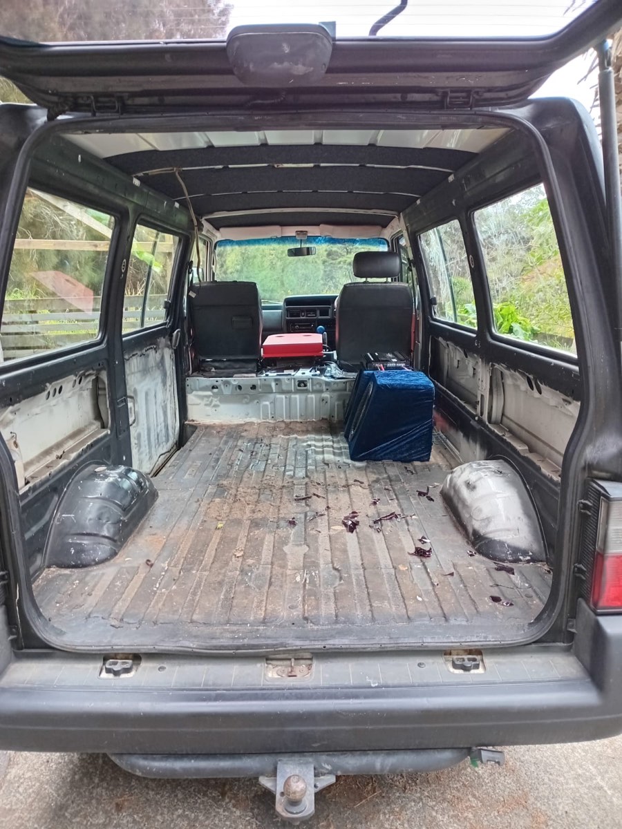 Toyota Hiace passenger van interior stripped to bare metal cargo floor — before re-trim at Jay's Auto Trim