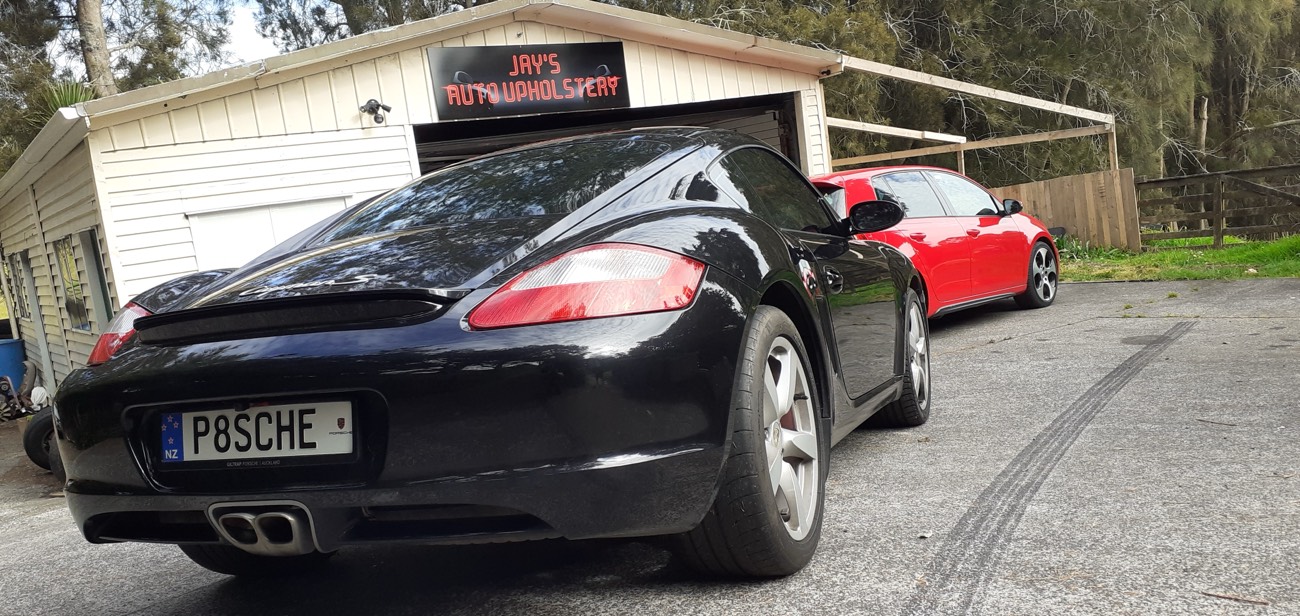 Two Porsches outside the Jay's Auto Trim workshop in Massey — high-end European interior work is regular